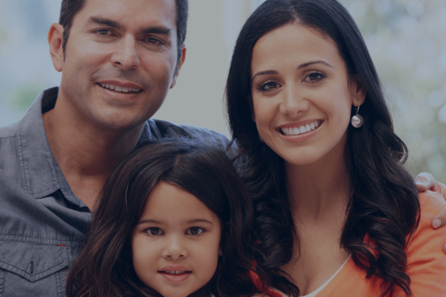 a family picture of a couple with their daughter